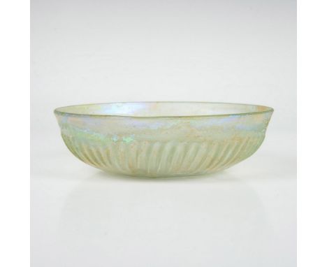 Round bowl decorated with vertical grooves around the body and a faint iridescent finish. The shine of pink, blue, green, yel