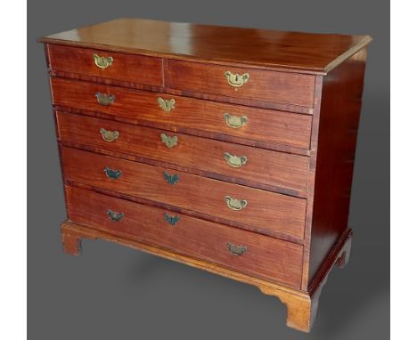 A 19th Century mahogany straight front chest of two short and four long drawers with brass handles raised upon bracket feet, 