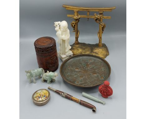 A Chinese carved soapstone figure together with a bronze dish decorated with birds, a Japanese brass model of Torii gate and 