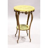 A TWO TIER ONYX-TYPE COFFEE TABLE on gilded legs, 1 ft. 5 in diameter.
