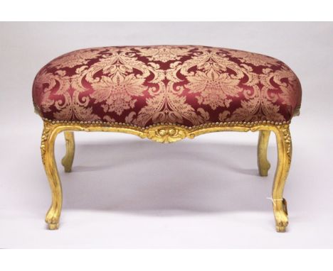 A GILT WOOD LARGE STOOL, with upholstered crimson, classical style fabric, on cabriole legs. 3 ft 4ins lonf x 2 ft wide x 2 f
