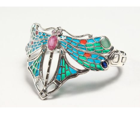 A SILVER RUBY EMERALD SAPPHIRE AND ENAMEL DRAGONFLY BANGLE