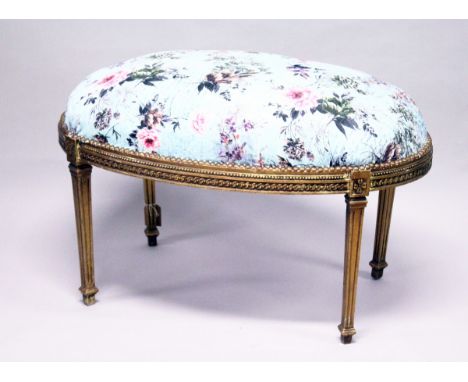 A GILT WOOD LARGE STOOL, upholstered with a  floral print, on square legs. 3 ft 3 ins long x 2 ft  wide x 2 ft  high.