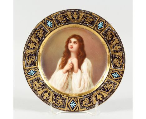 A GOOD VIENNA CIRCULAR PLATE, blue and gilt border, the centre painted with a portrait  'Aspiration' Vienna beehive mark in b