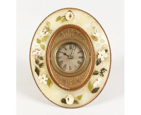 AN ONYX OVAL STRUTT TYPE CLOCK by BIRCH &amp; CAYDEN, Fenchurch Street. 8.5 ins x 6.5 ins