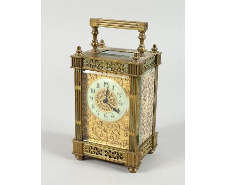 A 19TH CENTURY FRENCH BRASS CARRIAGE CLOCK with filigree face and coloured sides. 6ins.