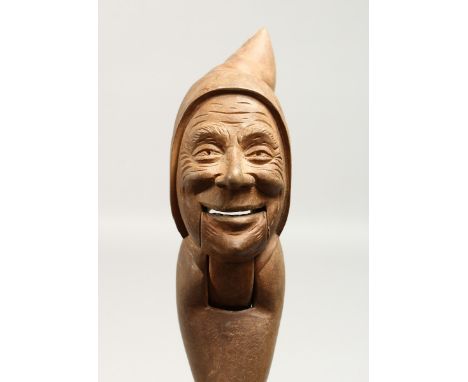 A CARVED WOOD DWARF NUTCRACKER.