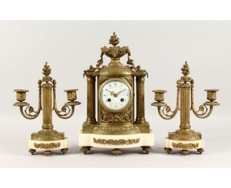 A GOOD LOUIS XVI DESIGN ORMOLU AND MARBLE THREE PIECE CLOCK GARNITURE, striking on a single bell, the clock with column sides
