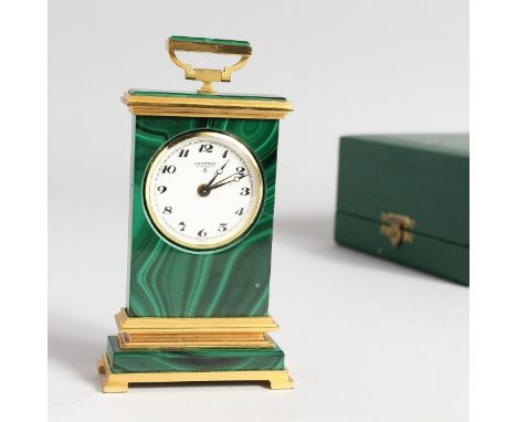 A LOOPING MALACHITE AND METAL CLOCK, 4 inches high in a fitted case.