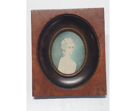 A painted miniature portrait in a walnut frame of a young Georgian lady signed A Bonini, overall dimensions 16x14cm