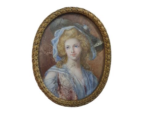 A Georgian painted miniature portrait of a lady in oval brass frame overall dimensions 11x9cm