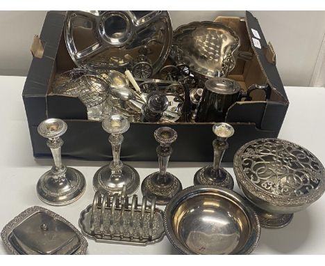 A box of assorted silver plate and other metal wares including candle sticks, shipping unavailable