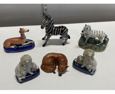 An assortment of antique ceramic animal figures, including Staffordshire A/F, shipping unavailable