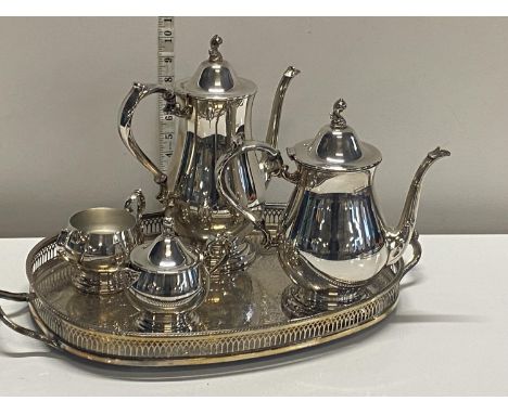 A vintage silver plated tea service on tray