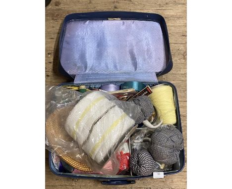 A vintage suitcase full of vintage wool and assorted knitting ephemera, shipping unavailable