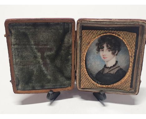 A Georgian hand painted miniature portrait of a young lady in a fitted case overall dimensions 8x6.5cm