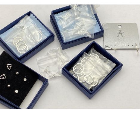 A large selection of 925 silver earrings hoops and studs