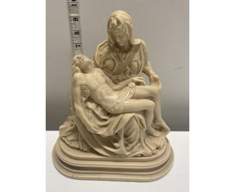 A heavy resin sculpture depicting 'The Madonna della Pietà' by Michelangelo