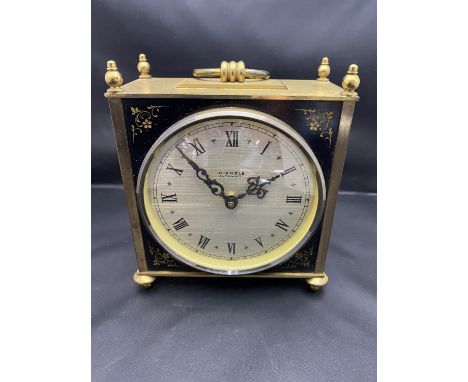 A vintage Kienzle automatic brass cased battery powered mantle clock