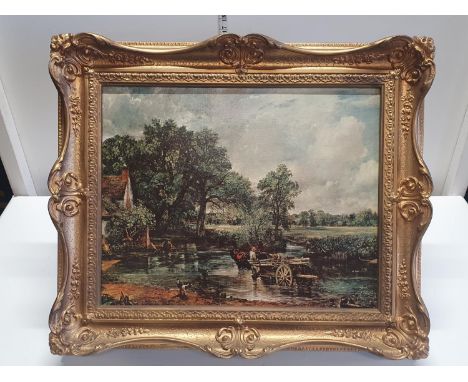 A framed print of 'The Hay Wain' J Constable in a ornate gilt frame overall dimensions 57x64cm