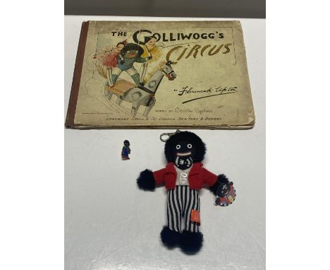 A collectable vintage book and a doll