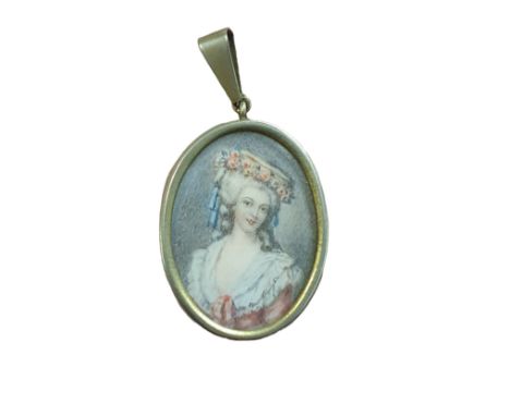 A small hand painted miniature portrait of a Georgian lady in the form of a locket