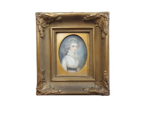 A Georgian painted miniature portrait of a lady in a gilt framed (signature illegible) overall dimensions 18x15cm