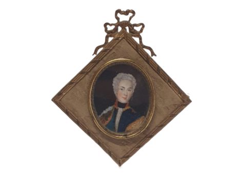 A Georgian painted miniature portrait of a gentleman in a elaborate brass frame overall dimensions 13x11cm