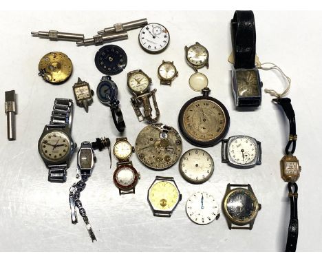 A tray of assorted antique and vintage watch parts and spares