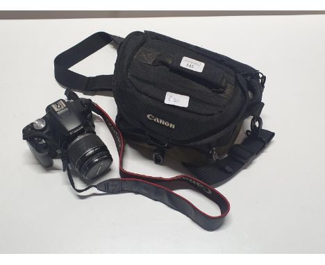 A Canon EOS 500D 35mm digital camera and lens (untested)
