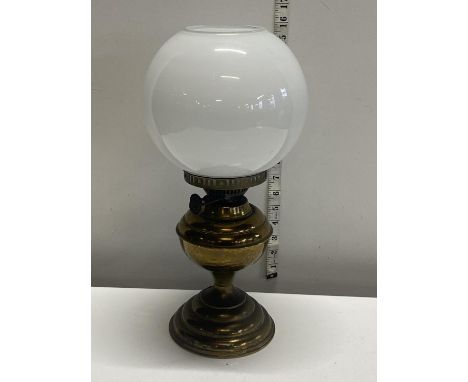 A Brass based oil lamp with shade (nibbles to shade) H:41