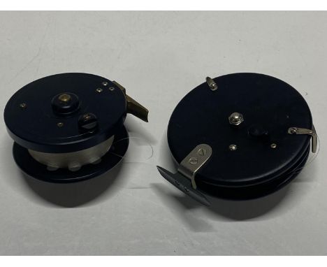 Two vintage center pin fishing reels
