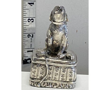 A hallmarked silver loaded dog paperweight