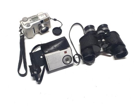 A vintage portable radio, Minolta digital camera with a pair of binoculars  (untested)