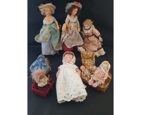 A selection of antique dolls including Peggy Nesbit and other bisque dolls.