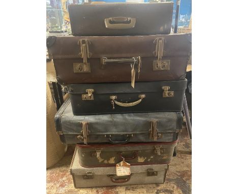 A job lot of vintage suitcases, shipping unavailable