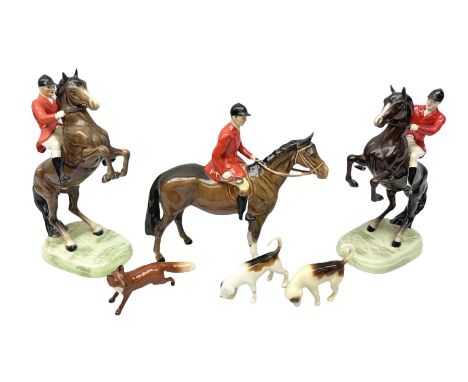 Beswick Hunting Group, comprising huntsman on bay horse, model no.1501, two huntsmen on bay horses, model no.868, together wi