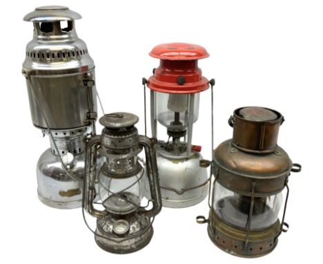 Copper and brass ship’s lamp marked ‘Anchor’, H25cm, Feuer hand storm lantern, Bialaddin Model 315 paraffin lamp and an Ancho