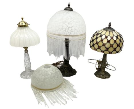 Art Deco style table lamp with a frosted glass shade with glass tassels, together with two other similar examples and another