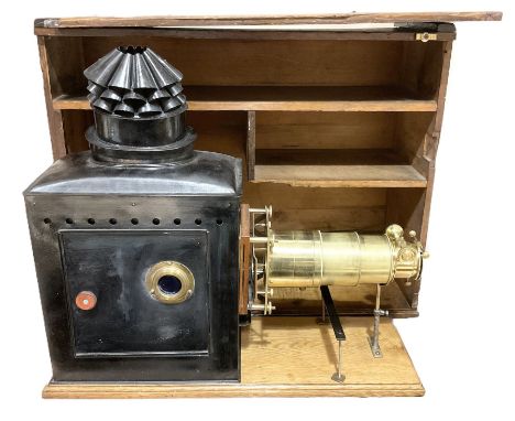 19th Century brass and tin magic lantern mounted upon a wooden base, with wooden carry case H59, L66cm
