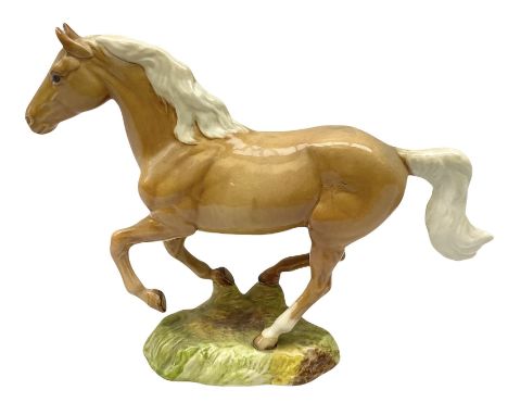 Beswick figure of cantering Palomino horse on base model no 1374, with impressed and printed mark beneath, H18cm