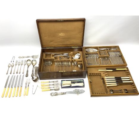 Oak cased Mappin &amp; Webb part canteen of silver plated Scroll pattern cutlery, the box with twin brass drop handles to sid