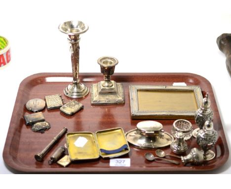 A group of silver including photograph frame, dwarf candlestick, bud vase, capstan inkwell, four vestas, George III decanter 