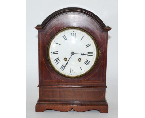 An Edwardian mantel clock in domed mahogany case 