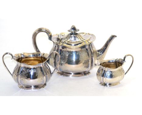A silver three piece tea service 