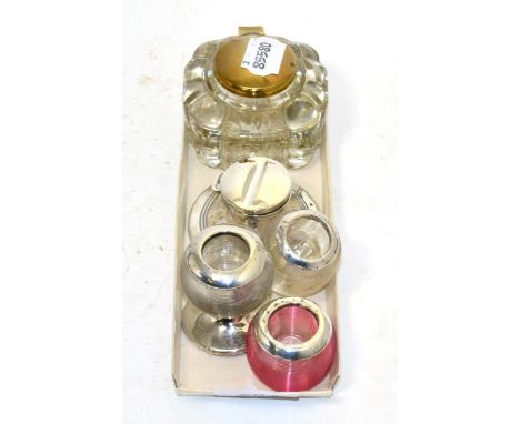 Three silver mounted match strikers, a silver capstan inkwell and another inkwell 