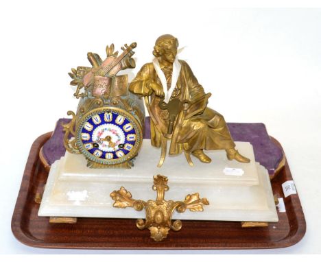 A gilt metal and alabaster striking mantel clock, circa 1900, raised upon a gilt wooden base 