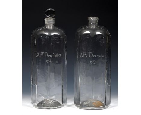A pair of 18th century clear glass decanters and a stopper, probably Irish, engraved ABm Devonsher, 1761 37 cm high (2)decant