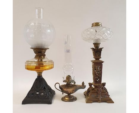 An oil lamp, with a clear glass well, 56 cm, an oil lamp in the form of a genie's lamp, 39 cm high, and an oil lamp base (3)O