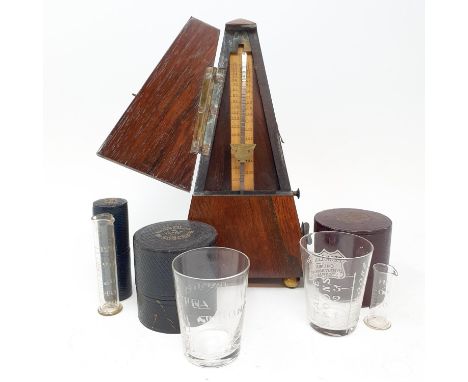 An early 20th century metronome, in a rosewood case, nine glass measures in leather cases and other items (box) 